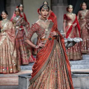 Stunning Indian model showcasing traditional attire at a New Delhi fashion show.